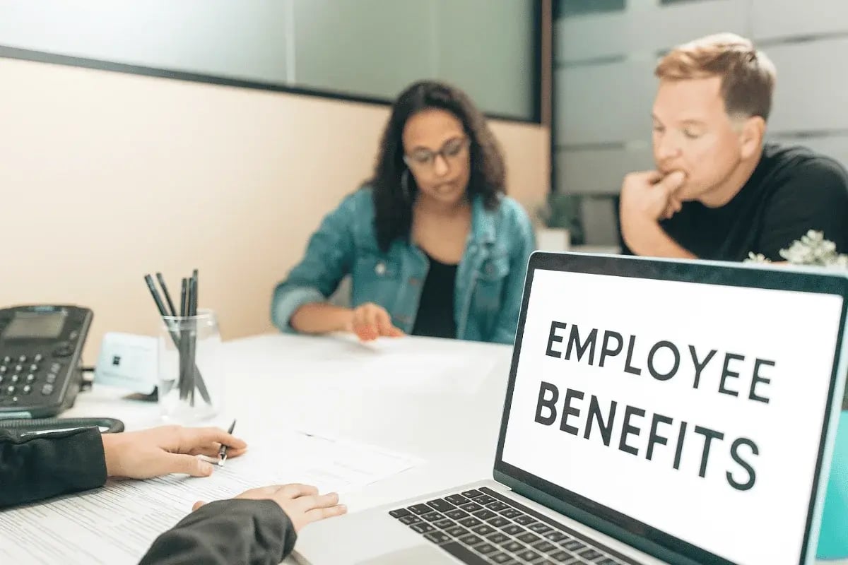 Employee benefits presentation in workplace conference room.
